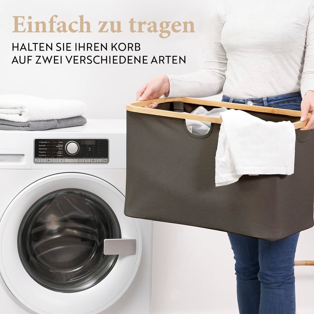Bambus Regal mit Ablage und Körben - Dunkelgrau, zeigt Stabilität und praktische Nutzung als Wäschekorb vor Waschmaschine.