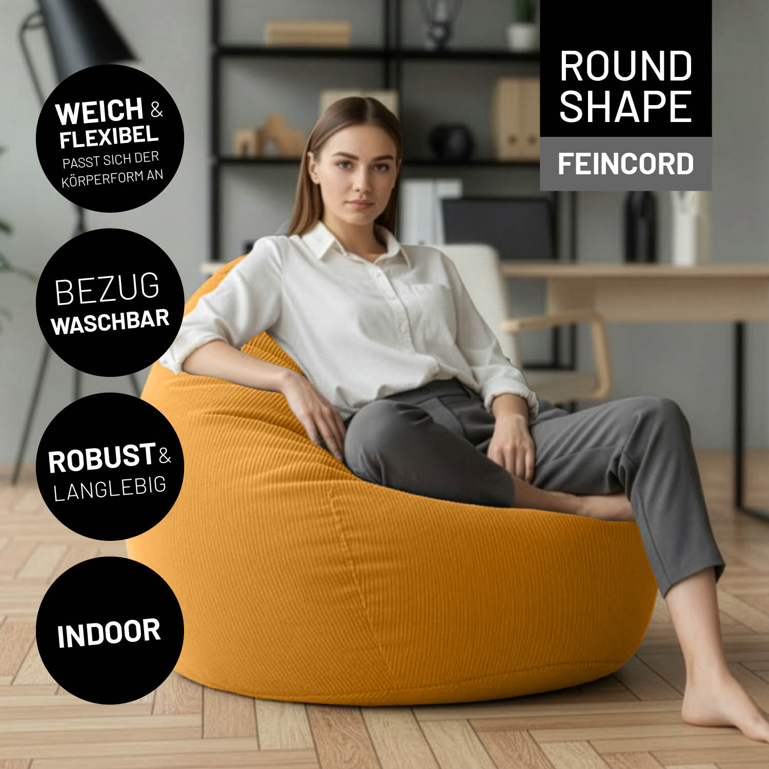Frau entspannt auf dem Comfort Line Sitzsack Feincord XL - 250 L - Senfgelb in modernem Wohnzimmer mit Holzfußboden.