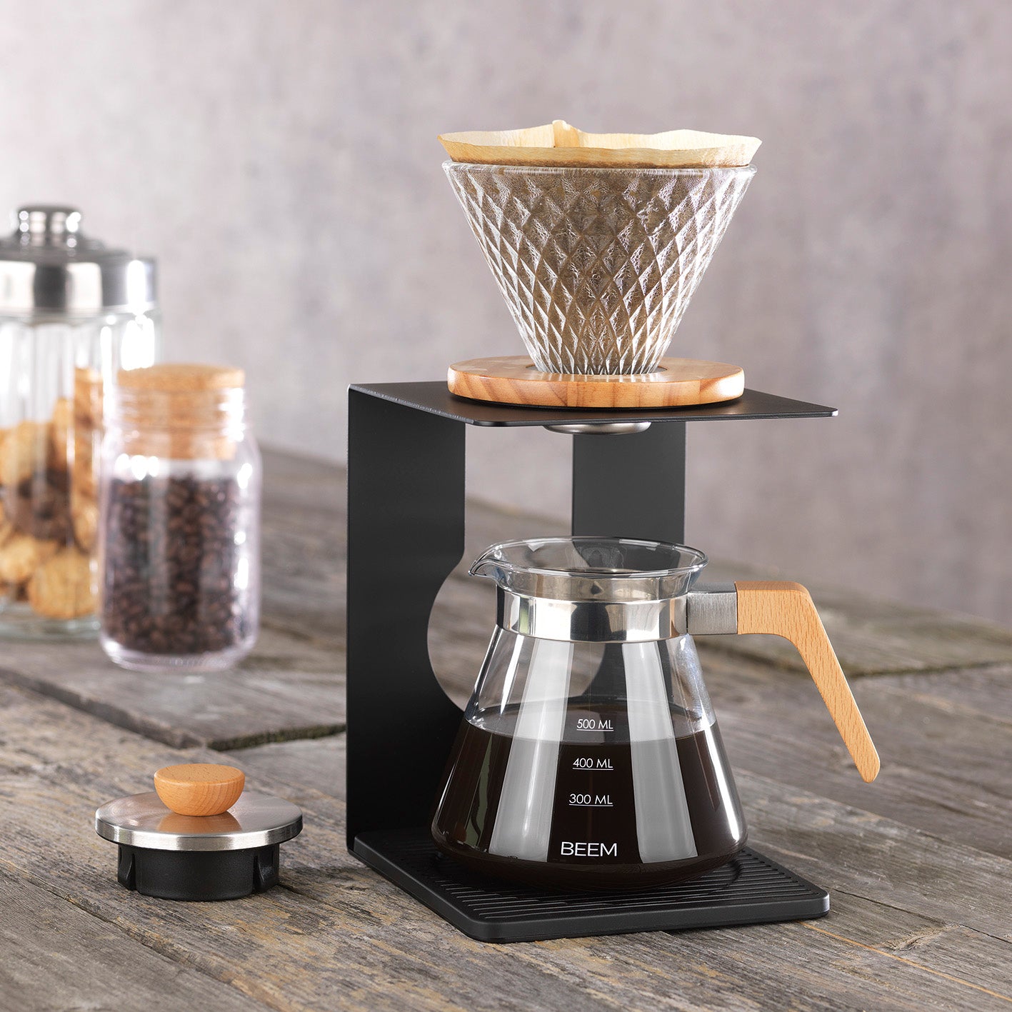 Kaffeebereiter Set Pour Over - 4-tlg. - 600 ml - schwarz/Edelstahl mit Glaskanne, Holzgriff und verstellbarem Aluminiumgestell.