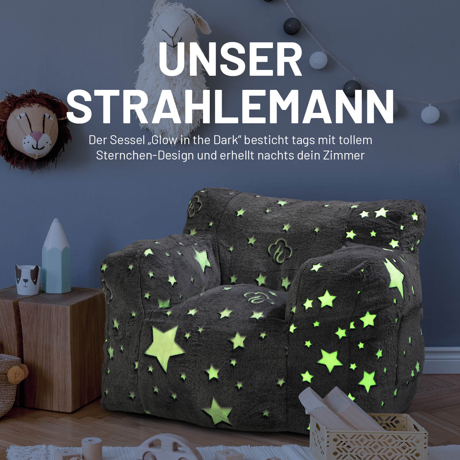 Sessel „Glow in the Dark“ - Grau mit leuchtendem Sternen-Design, weich und kuschelig für gemütliche Momente im Kinderzimmer.
