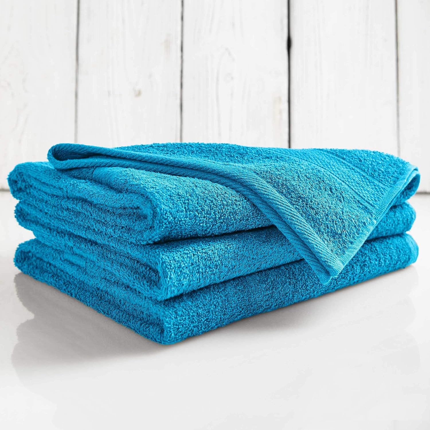 Premium Handtuch-Set - 2 Handtücher (50 x 100 cm) + 2 Badetücher (70 x 140 cm) - Türkis, aus saugfähiger Baumwolle.