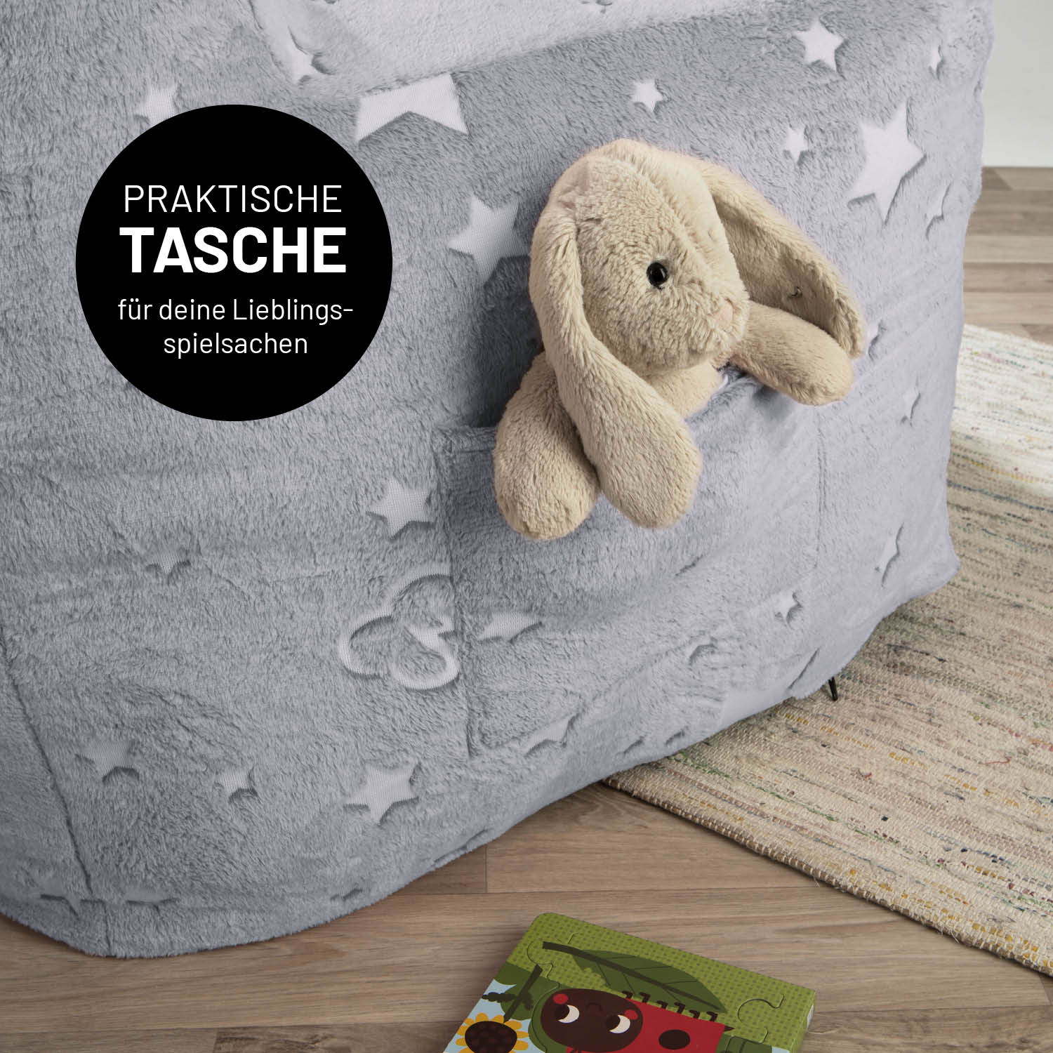 Sessel „Glow in the Dark“ - Grau mit praktischem Aufbewahrungsfach und leuchtendem Sternenmuster für Kinderzimmerkomfort und Spielspaß.