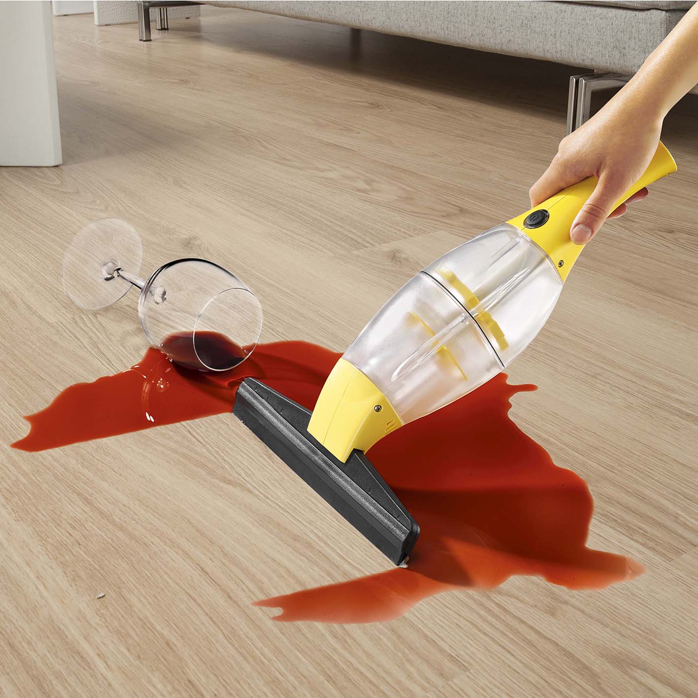 Akku-Fensterreiniger - Gelb saugt verschütteten Rotwein auf glattem Boden kabellos ohne Herabtropfen auf.